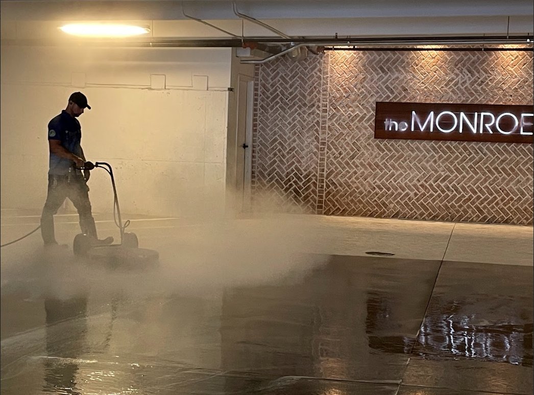 Night shift garage pressure washing crew at work