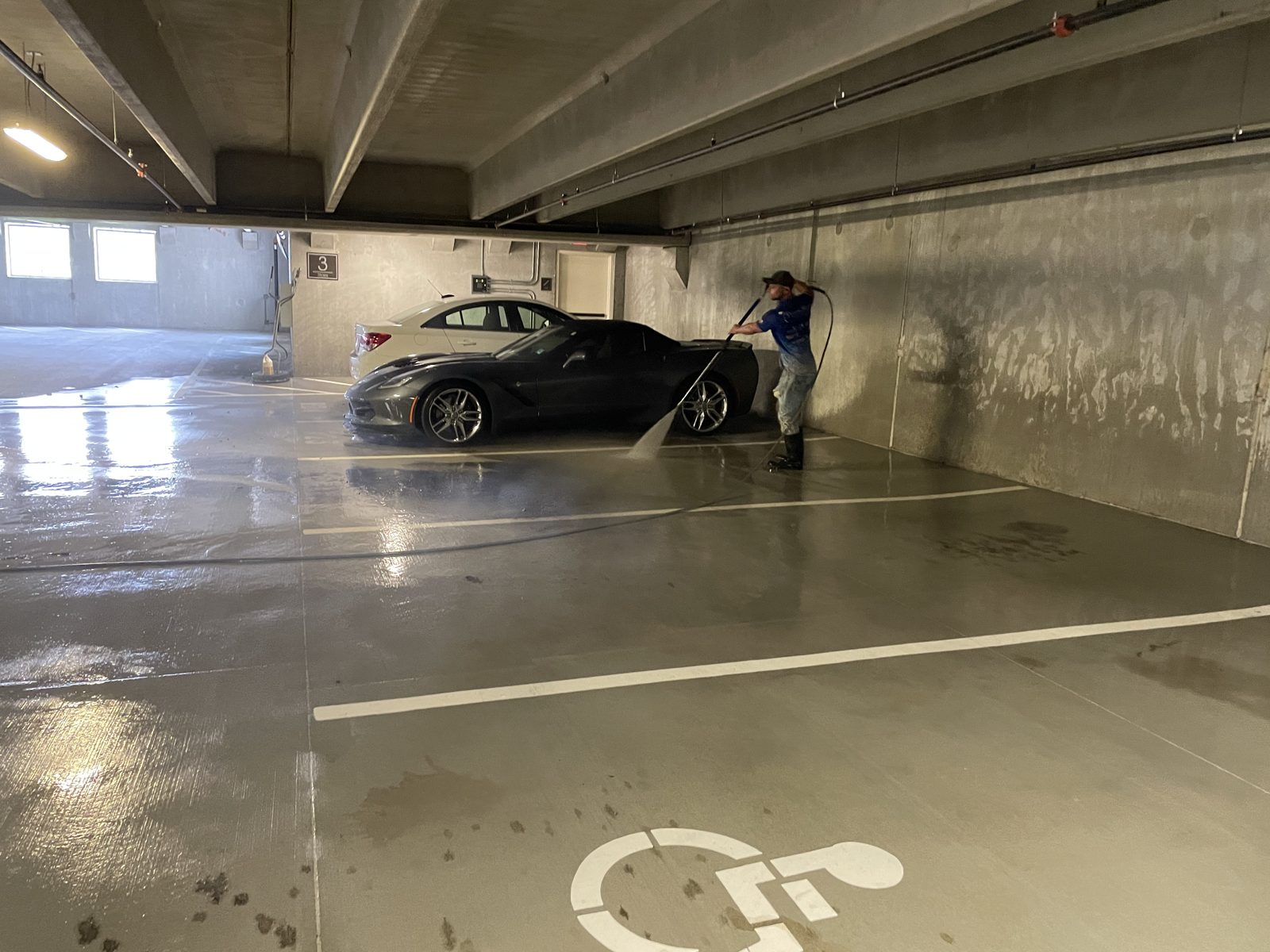 The deck mid wash, vehicles still in place on the level being worked.
