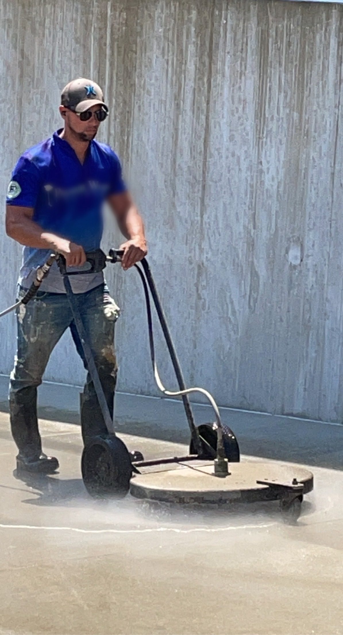 Surface cleaning a concrete elevation, self-performed.