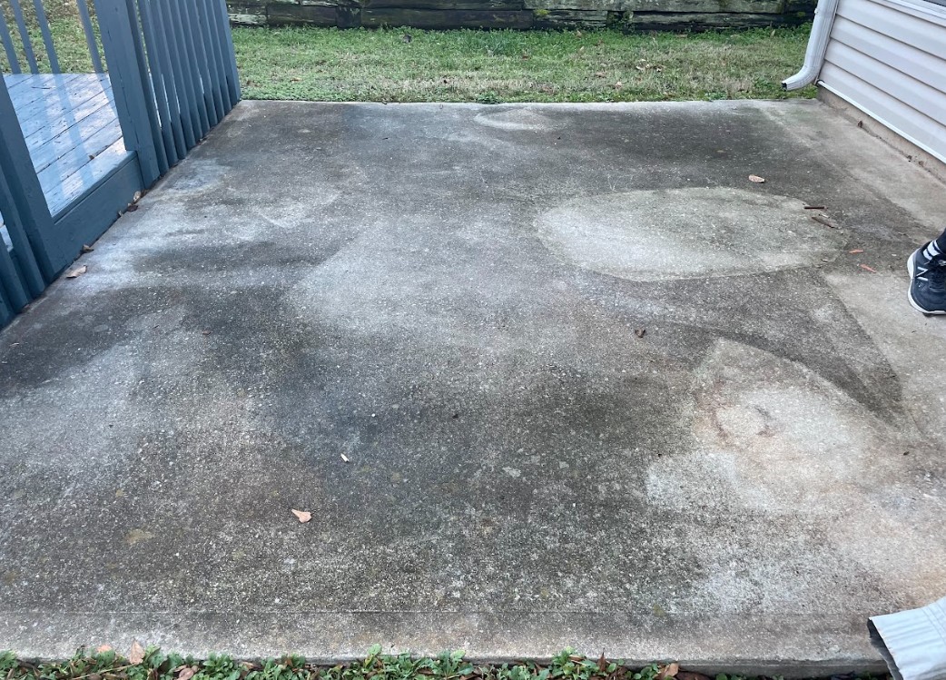 Concrete surface before pressure washing by Thrare Contracting