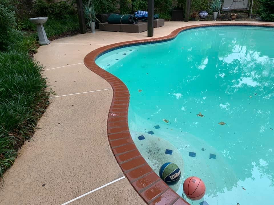 Pool deck surface after cleaning by Thrare Contracting